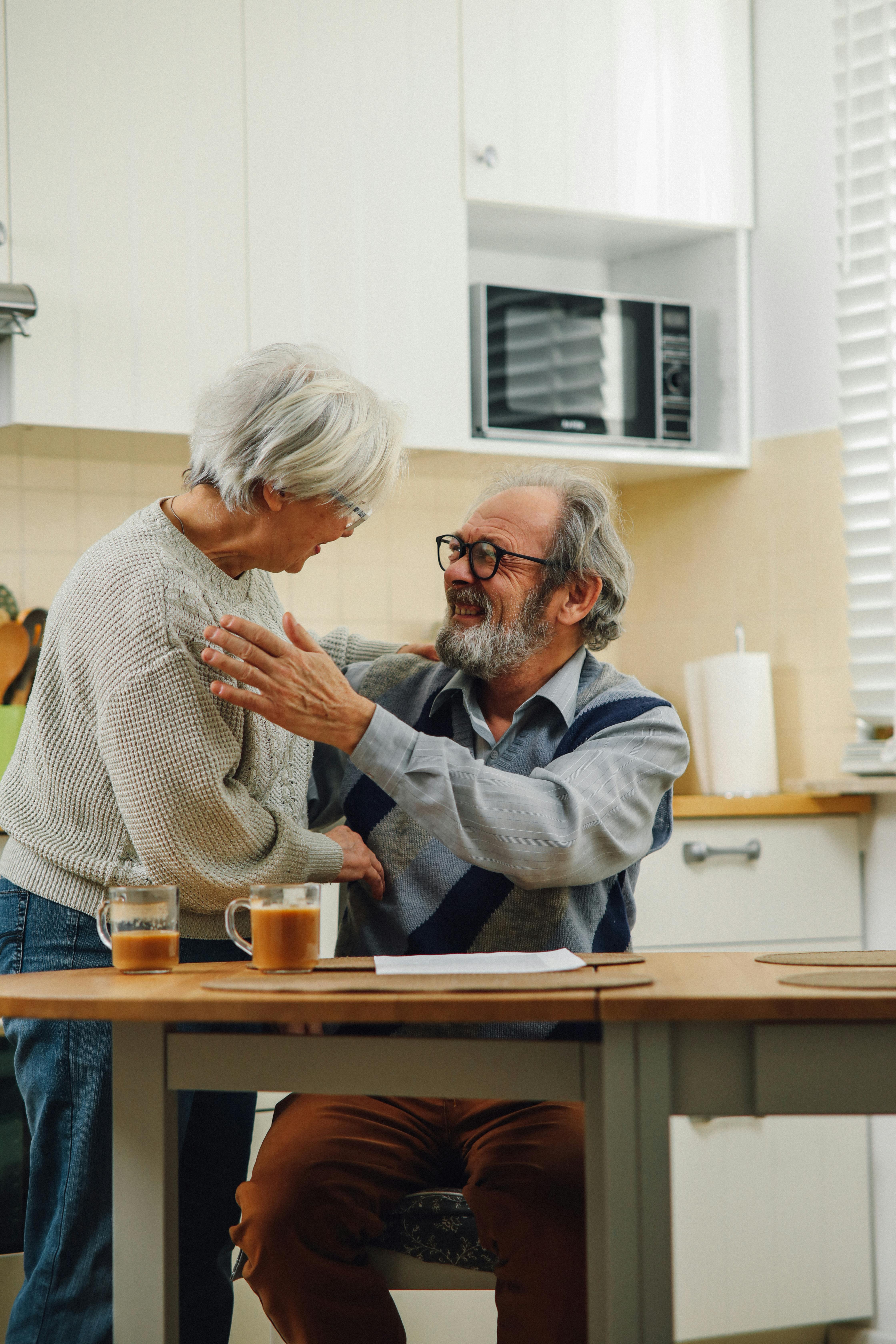 Senior couple smiling at home